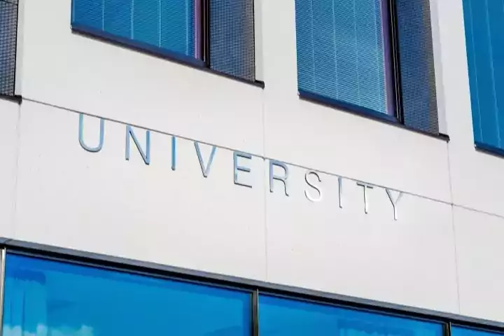 Oracle Signs Texas - Picture of a university sign on the side of a building