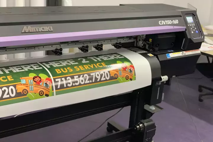 Oracle Signs Texas - Photo of a wide format printing job in progress.